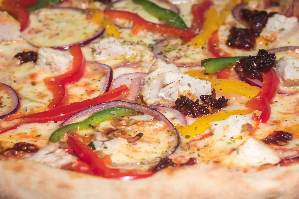 Close up photo of a pizza made by Tamburinos